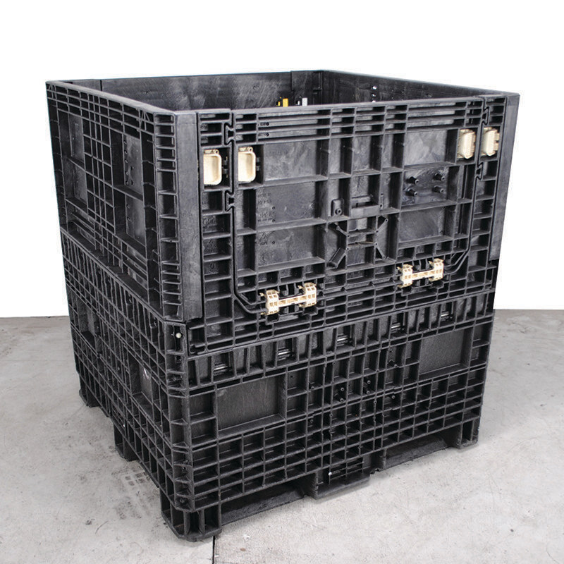 Tall used black collapsible bulk container shown upright with its access door closed.